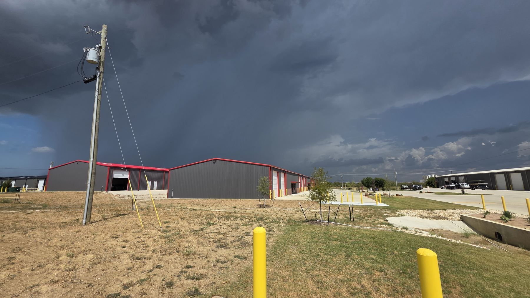 Storm clouds rolling in over the Pushing Metal shop in Venus, TX